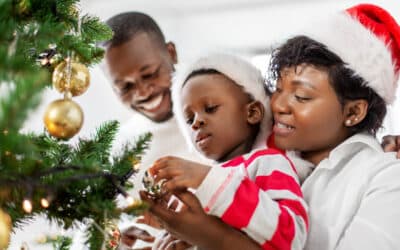 Family decorating Christmas Tree