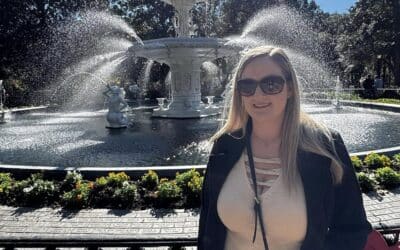 Attorney Brian's wife Stephanie stands in front of Forsyth Fountain