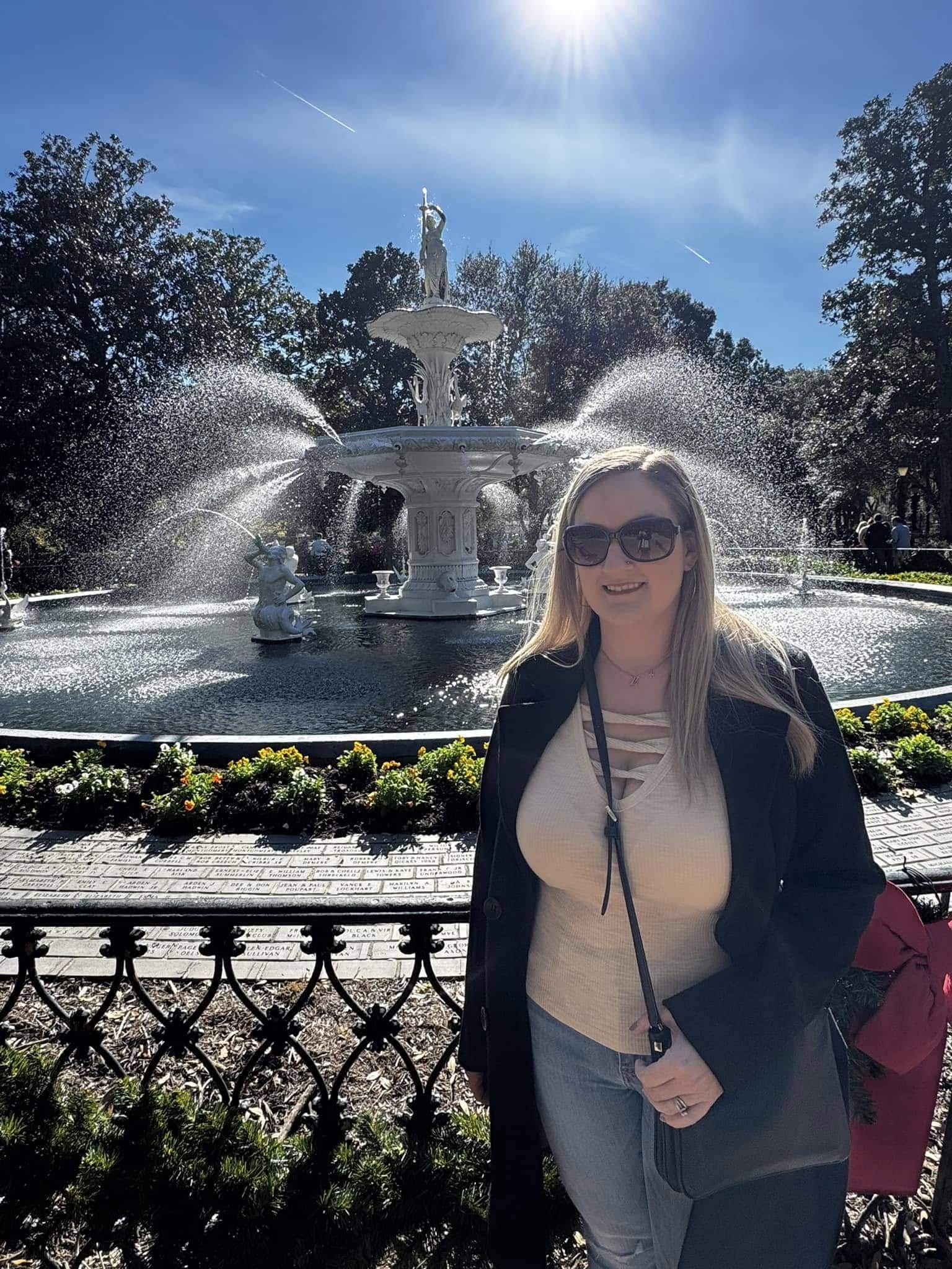 Attorney Brian's wife Stephanie stands in front of Forsyth Fountain